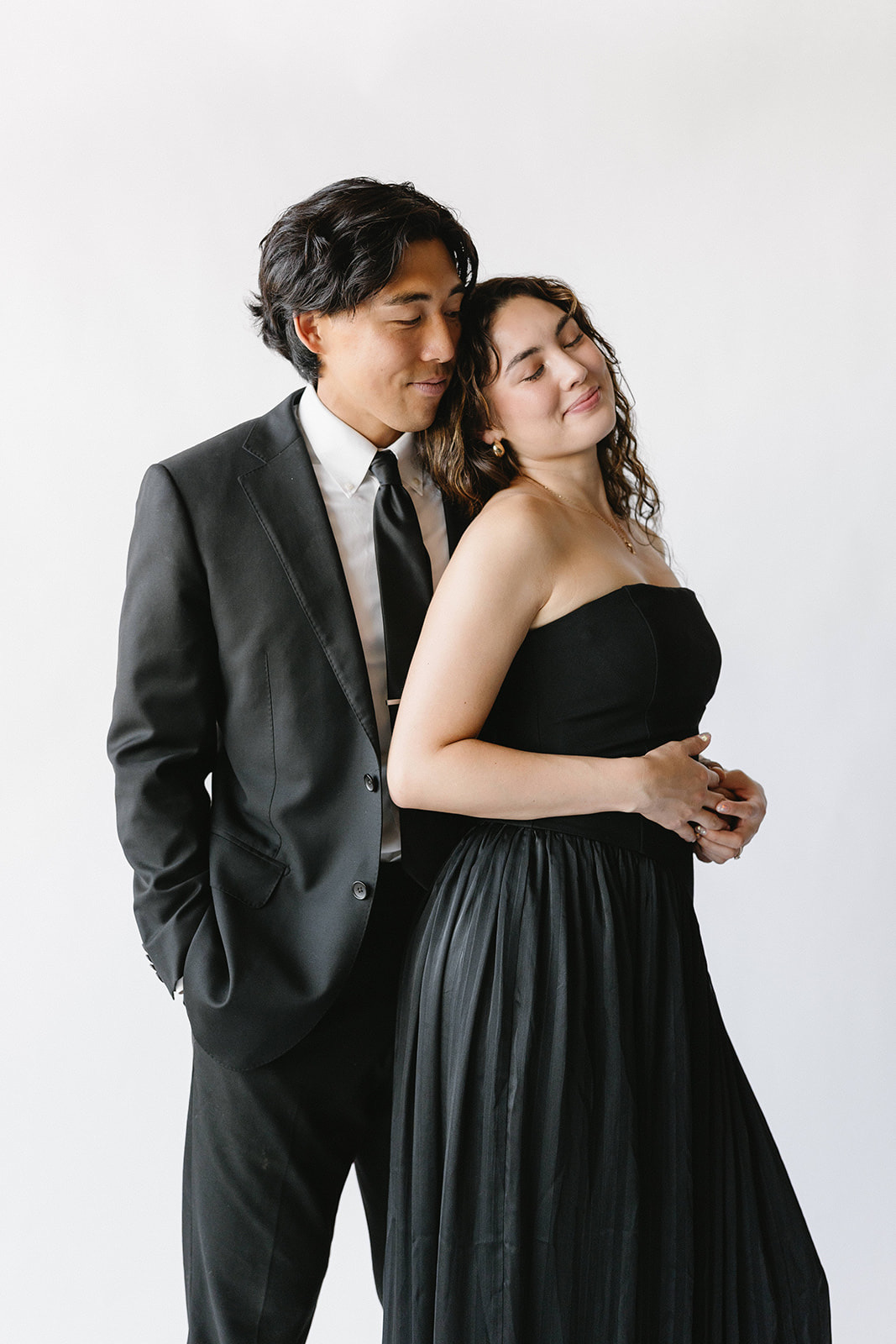 Two guests posing together in formal dress